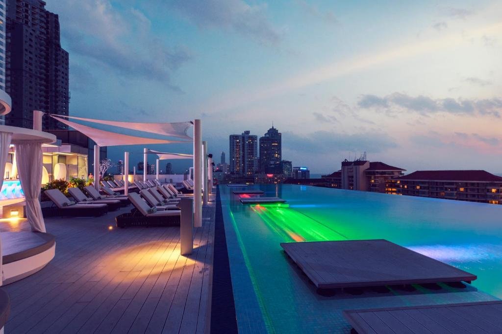 Rooftop infinity pool at Cinnamon Life Colombo with skyline view